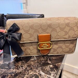 Coach Brown and Tan Clutch with Black Bow